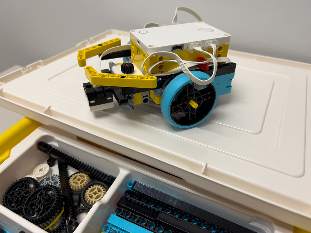 a small robot with two wheels made out of legos